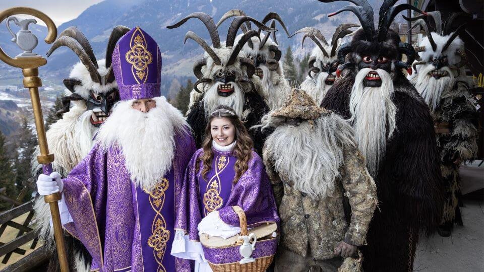 Costumed procession of St. Nicholas, an angel and kramus in Austria, Salzburg